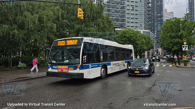 MTA New York City 8068 on the T323 7 shuttle 
Route T323 to Vernon Road, Jackson Avenue
7 Train Shuttle

